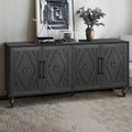 Grand meuble de rangement avec portes sculptées motif floral et poignées en métal, idéal pour le salon, la cuisine ou l'entrée.
