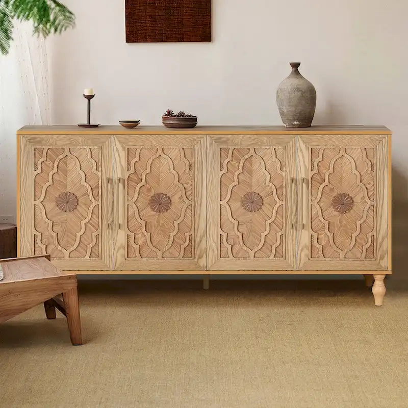 Grand meuble de rangement avec portes sculptées motif floral et poignées en métal, idéal pour le salon, la cuisine ou l'entrée.